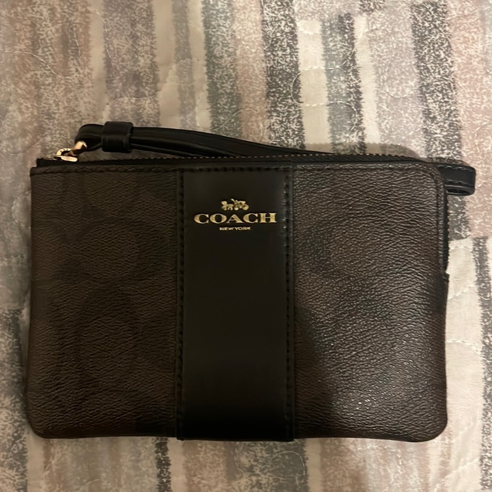 Coach wristlet in brown with the coach print